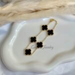 Close-up of 18K gold plated clover bracelet for women.