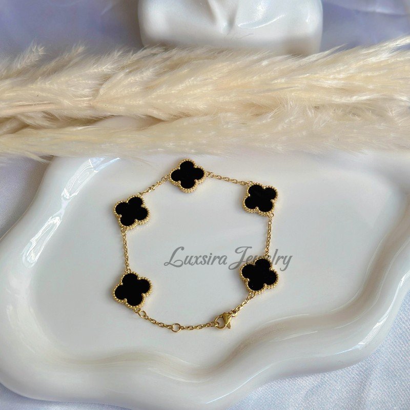 Stylish Black Clover Charm Bracelet in Gold Finish Fashion bracelet with black clover and gold plated chain.